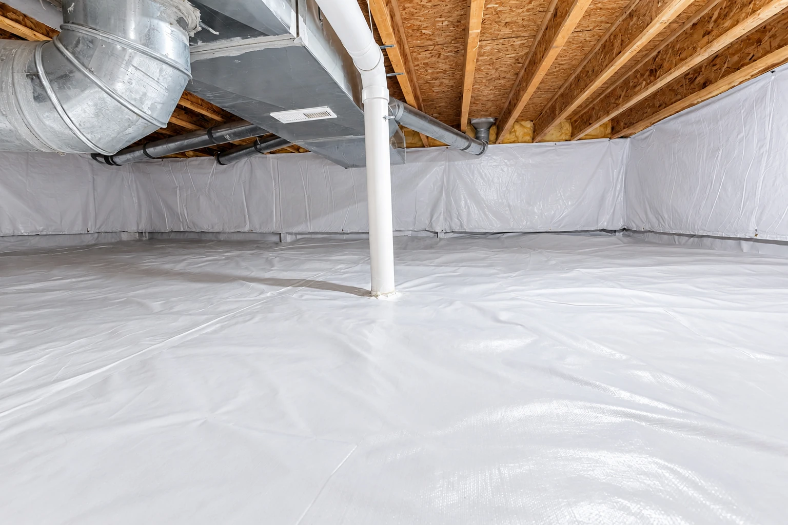 Crawl space with white vapor barrier covering the floor and walls beneath exposed joists and ductwork.